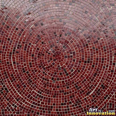 Roman style stone mosaic with a border pattern in whitewashed tones