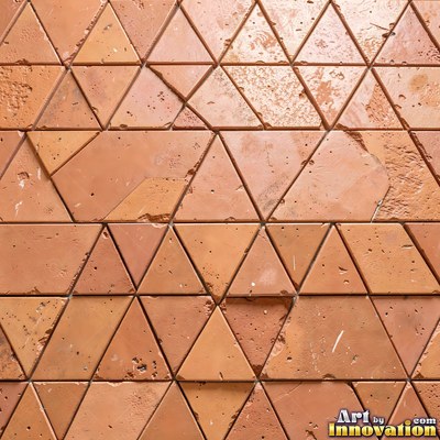 Broken tile mosaic of irregular yellow shards set in gray grout