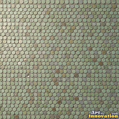 Broken tile mosaic of irregular yellow shards set in gray grout