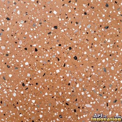 Minimal terrazzo with sparse chips on a smooth warm yellow base