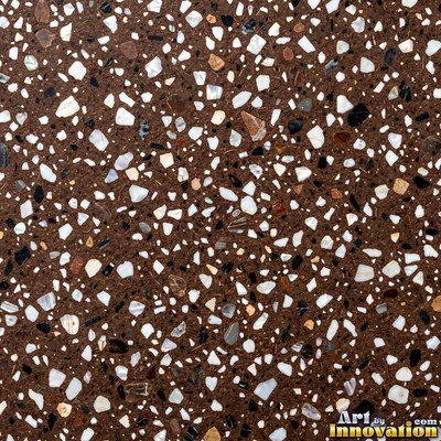 Minimal terrazzo with sparse chips on a smooth warm yellow base