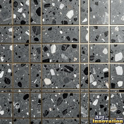 Minimal terrazzo with sparse chips on a smooth warm yellow base