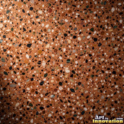 Black and white terrazzo flecked with mother of pearl, evenly lit