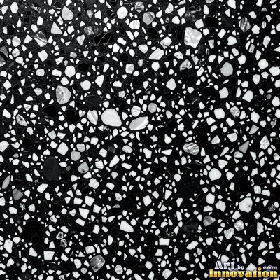 Polished terrazzo with small stone chips scattered evenly across a charcoal base