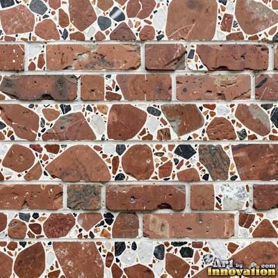 Polished terrazzo with small stone chips scattered evenly across a charcoal base