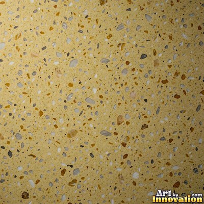 Minimal terrazzo with sparse chips on a smooth warm yellow base