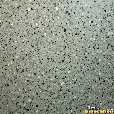 Polished terrazzo with small stone chips scattered evenly across a charcoal base