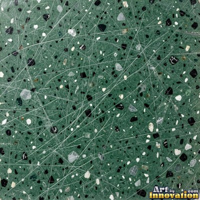 Minimal terrazzo with sparse chips on a smooth warm yellow base