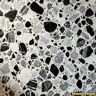 Black and white terrazzo flecked with mother of pearl, evenly lit