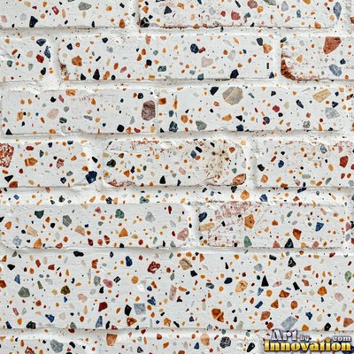 Minimal terrazzo with sparse chips on a smooth warm yellow base