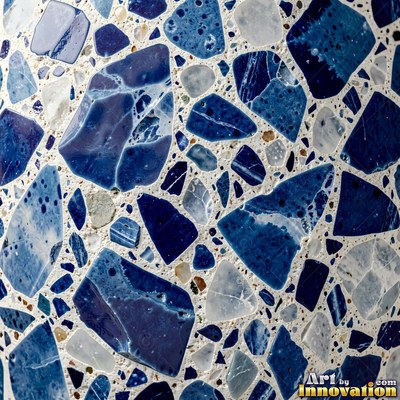 Minimal terrazzo with sparse chips on a smooth warm yellow base