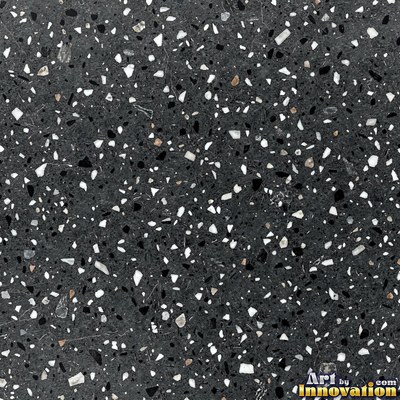 Minimal terrazzo with sparse chips on a smooth warm yellow base