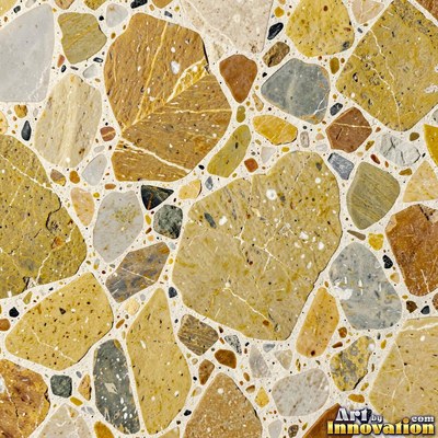 Minimal terrazzo with sparse chips on a smooth warm yellow base