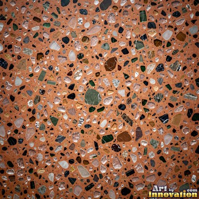 Minimal terrazzo with sparse chips on a smooth warm yellow base