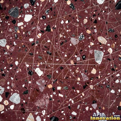 Minimal terrazzo with sparse chips on a smooth warm yellow base