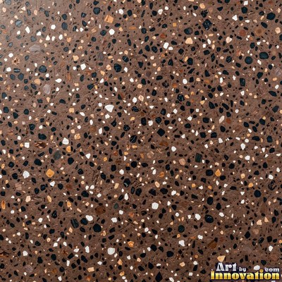 Minimal terrazzo with sparse chips on a smooth warm yellow base