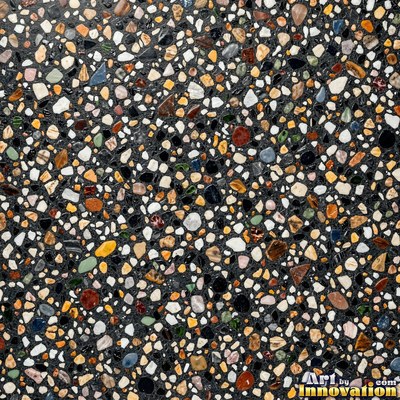 Black and white terrazzo flecked with mother of pearl, evenly lit