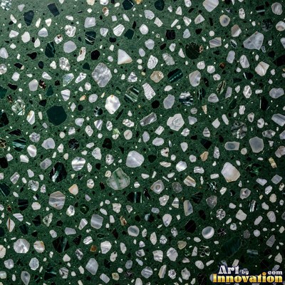 Polished terrazzo with small stone chips scattered evenly across a charcoal base