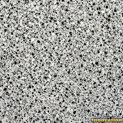 Polished terrazzo with small stone chips scattered evenly across a charcoal base