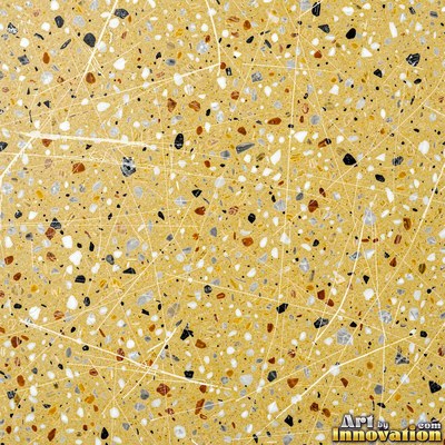 Minimal terrazzo with sparse chips on a smooth warm yellow base