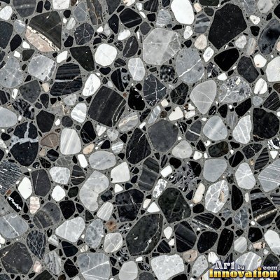 Polished terrazzo with small stone chips scattered evenly across a charcoal base