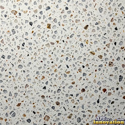 Minimal terrazzo with sparse chips on a smooth warm yellow base