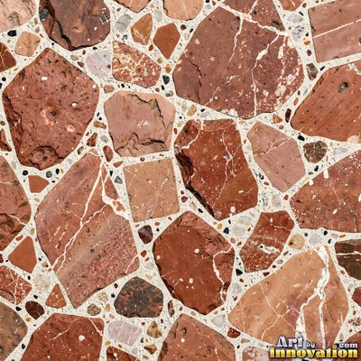 Minimal terrazzo with sparse chips on a smooth warm yellow base
