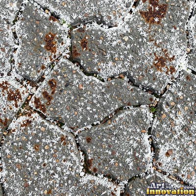 Wet asphalt glistening with small puddles in a greenish gray tone