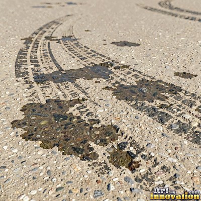 Worn asphalt with faded fragments of painted road lines
