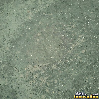 Wet asphalt glistening with small puddles in a greenish gray tone
