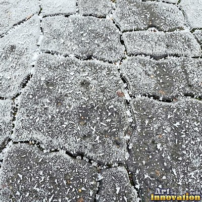 Fresh light gray asphalt with fine gravel texture, flat overhead view