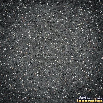 Asphalt pavement marked with oil stains and tire scuffs in medium gray