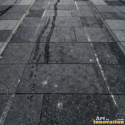 Fresh light gray asphalt with fine gravel texture, flat overhead view