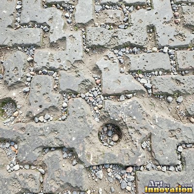 Fresh light gray asphalt with fine gravel texture, flat overhead view