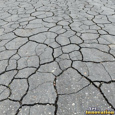 Fresh light gray asphalt with fine gravel texture, flat overhead view