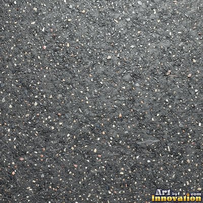 Wet asphalt glistening with small puddles in a greenish gray tone