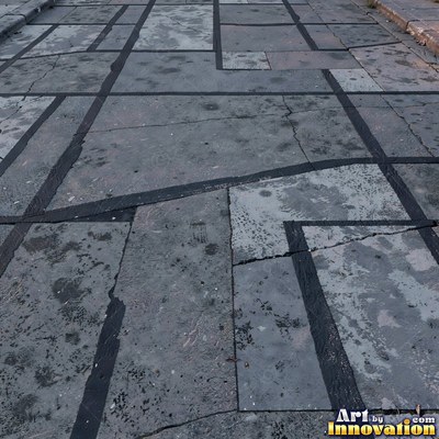 Fresh light gray asphalt with fine gravel texture, flat overhead view