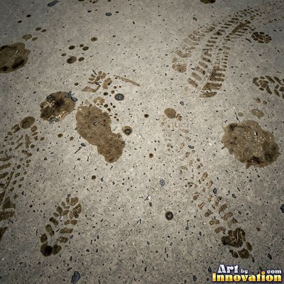 Wet asphalt glistening with small puddles in a greenish gray tone