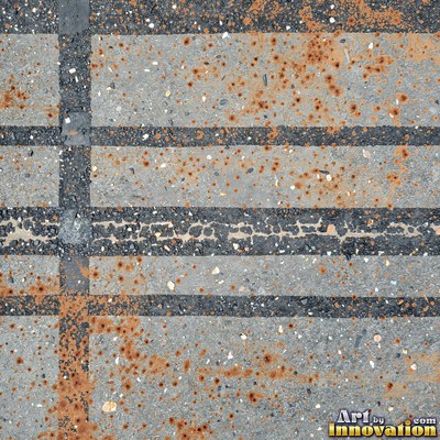 Worn asphalt with faded fragments of painted road lines