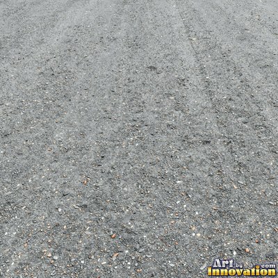 Wet asphalt glistening with small puddles in a greenish gray tone