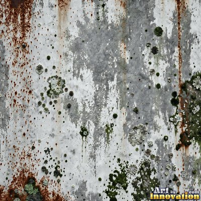 Smoke stained ochre wall with dark soot gradients across the surface