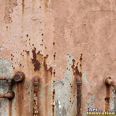 Blackened grunge wall with dried paint splatter filling the frame