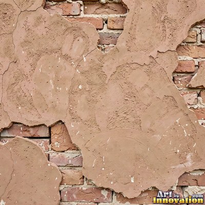 Grungy beige wall splattered with old paint drips, shot flat and even
