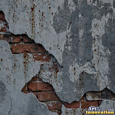 Blackened grunge wall with dried paint splatter filling the frame