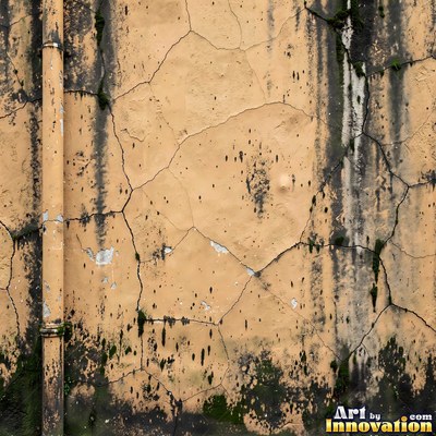 Grungy beige wall splattered with old paint drips, shot flat and even