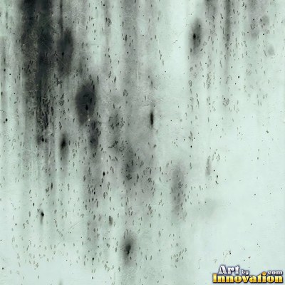Grungy beige wall splattered with old paint drips, shot flat and even