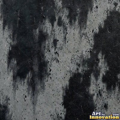 Blackened grunge wall with dried paint splatter filling the frame