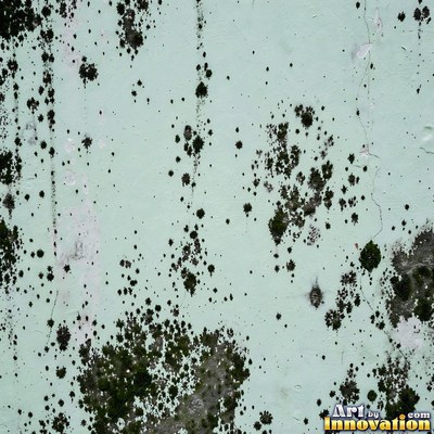 Smoke stained ochre wall with dark soot gradients across the surface
