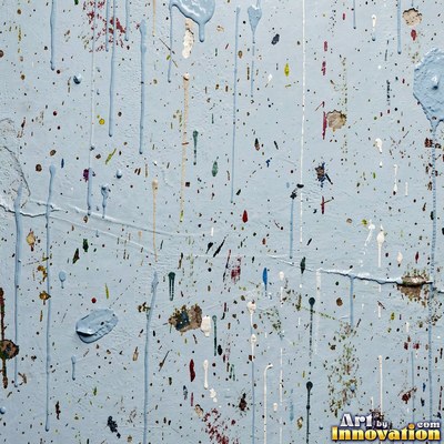 Blackened grunge wall with dried paint splatter filling the frame