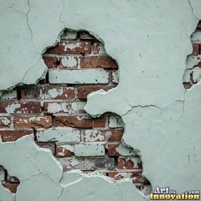 Blackened grunge wall with dried paint splatter filling the frame